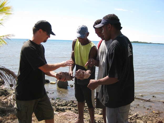 Fiji village farmers planting coral as part of the ADE project