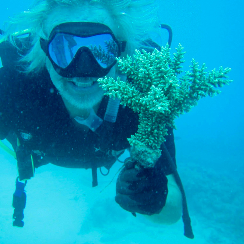 Walt Smith showing off a coral from one of the racks that is ready for the reef. ADE Project Fiji